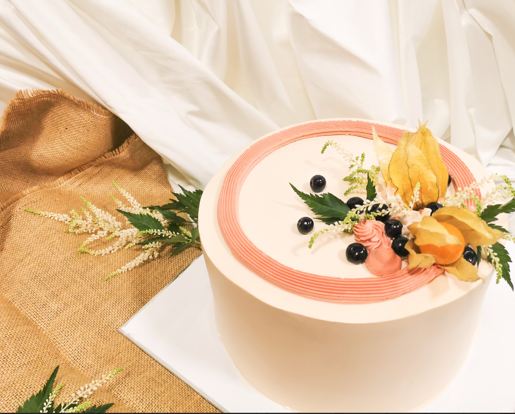 cake adorned with rose sugar flowers 